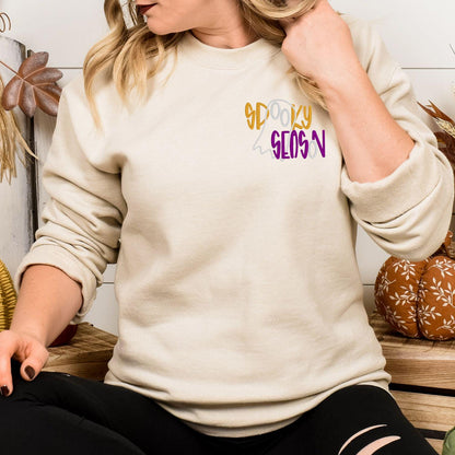 Sand Spooky Season embroidered sweatshirt with minimalist ghost design, lifestyle view