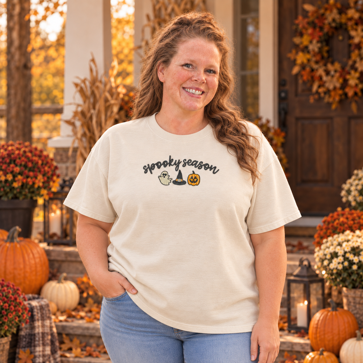Woman wearing an ivory Comfort Colors Spooky Season embroidered short sleeve tee