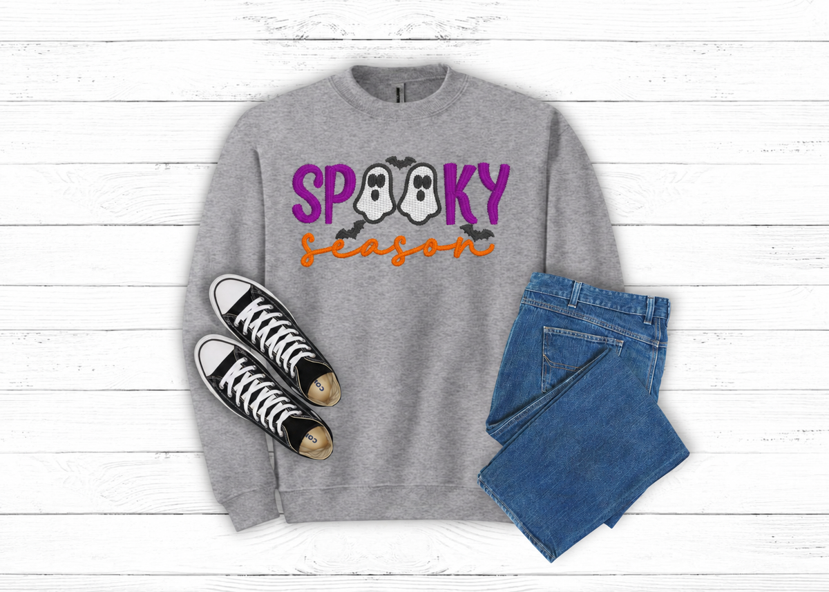 Spooky Season ghost embroidered gray sweatshirt flat lay with black sneakers and jeans