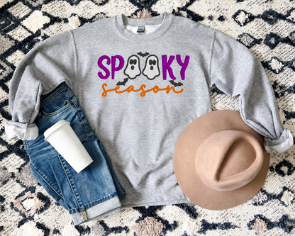 Spooky Season ghost embroidered Sport Grey sweatshirt flat lay with jeans and tan hat