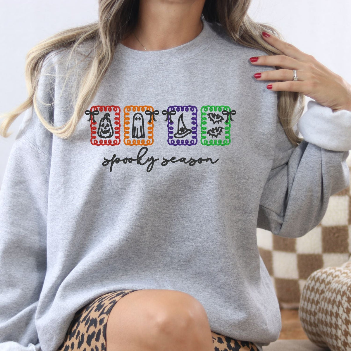 Ash Spooky Season embroidered sweatshirt with four colorful Halloween icon frames