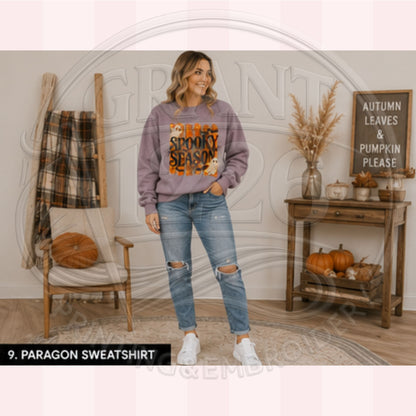 Woman wearing Paragon purple Spooky Season Halloween sweatshirt with retro ghost design