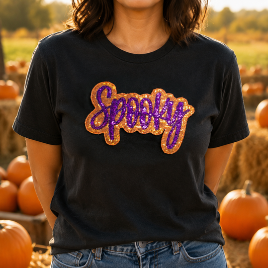 Black Comfort Colors 1717 Halloween tee with orange and purple Spooky sequin applique at a pumpkin patch