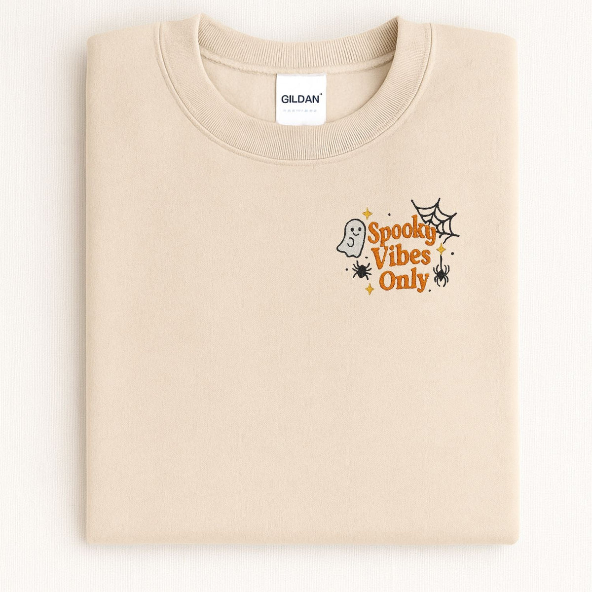 Sand Spooky Vibes Only embroidered sweatshirt with ghost and spiderweb, lifestyle view
