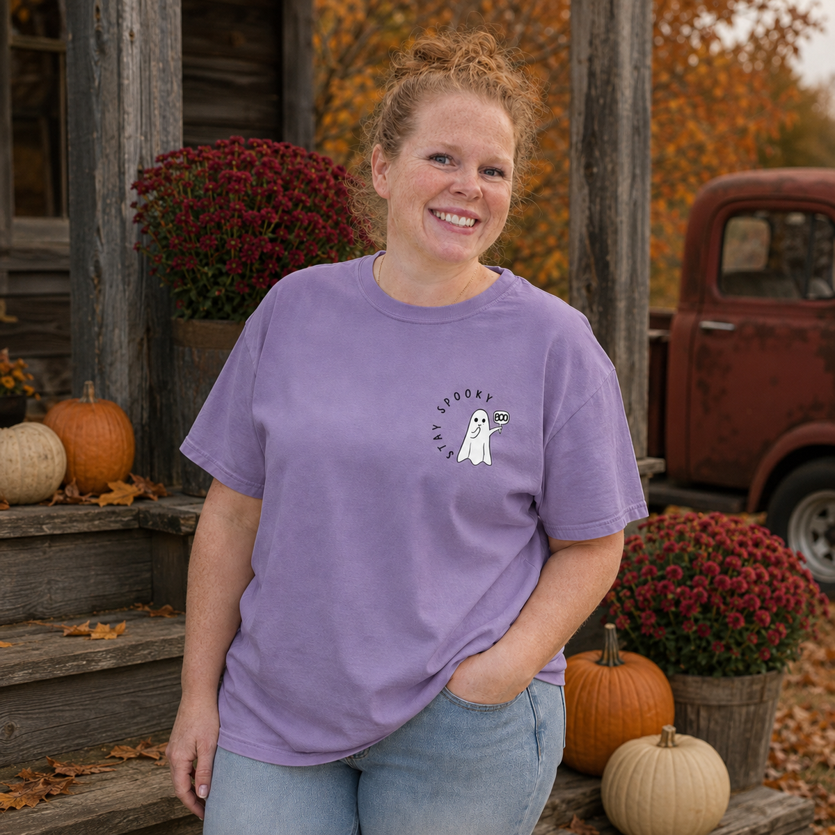 Stay Spooky ghost embroidered Comfort Colors 1717 Violet T-shirt modeled by Samantha on a rustic fall porch