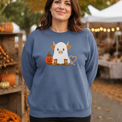 Woman wearing a Stone Blue embroidered ghost Highland cow Halloween crewneck sweatshirt