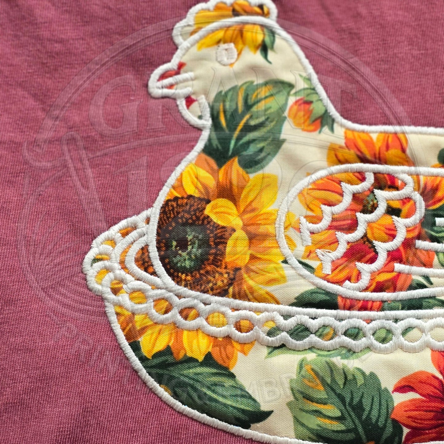 Sunflower chicken applique embroidery detail on brick Comfort Colors shirt