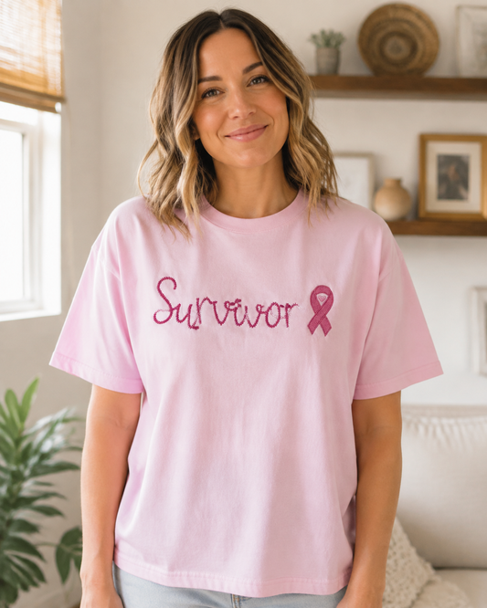 Embroidered Survivor breast cancer awareness design on a Comfort Colors 1717 Blossom short sleeve shirt