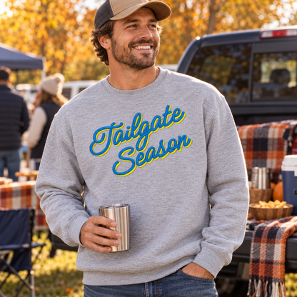 Adult Sport Grey Tailgate Season embroidered crewneck with blue and yellow thread at a fall football tailgate