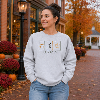 Ash embroidered sweatshirt with three Thanksgiving postage-stamp designs and Thankful lettering
