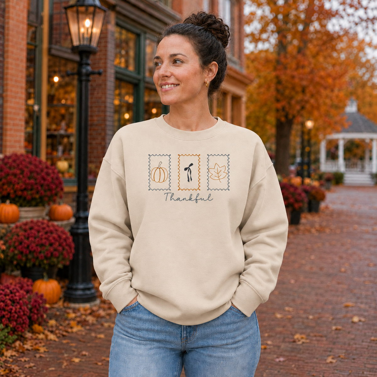 Sand embroidered sweatshirt with three Thanksgiving postage-stamp designs and Thankful lettering