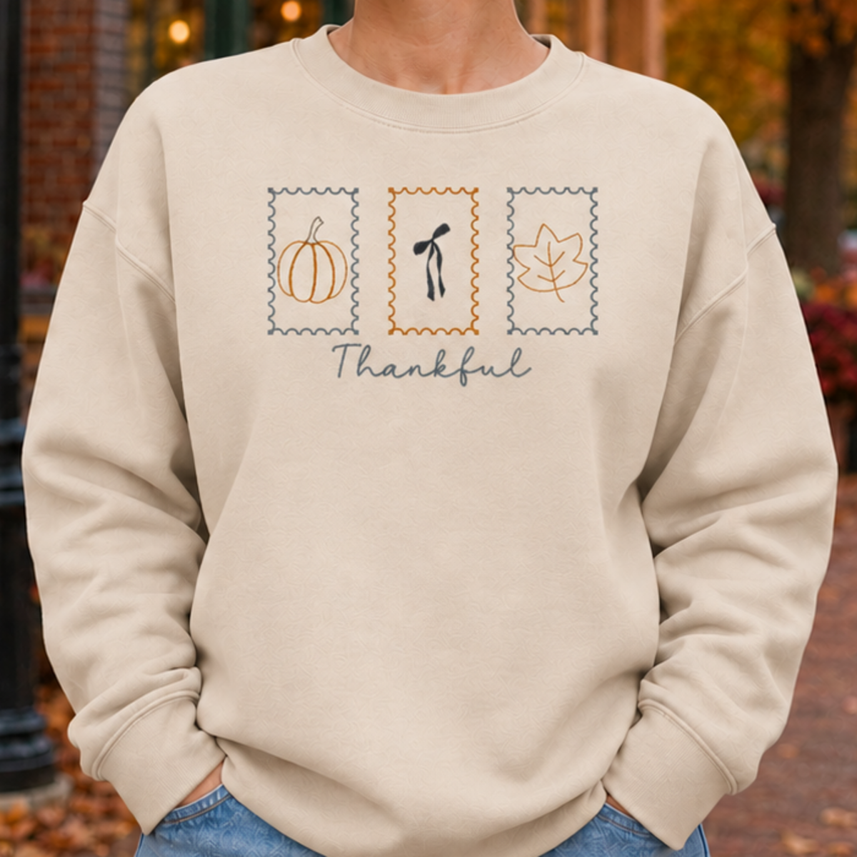 Sand Thankful Stamps embroidered sweatshirt fit and chest placement