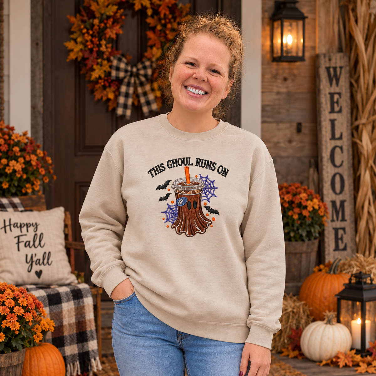 Woman wearing Sand This Ghoul Runs on Iced Coffee embroidered sweatshirt