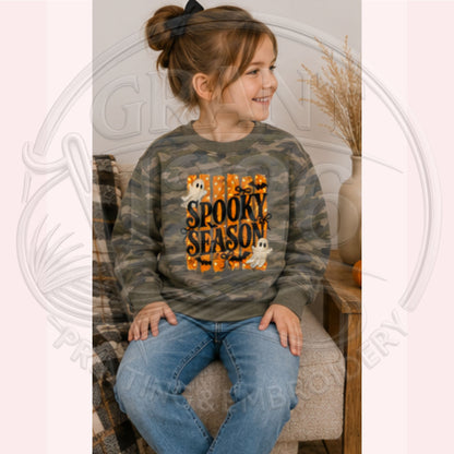 Toddler wearing camo Spooky Season Halloween sweatshirt with ghost design