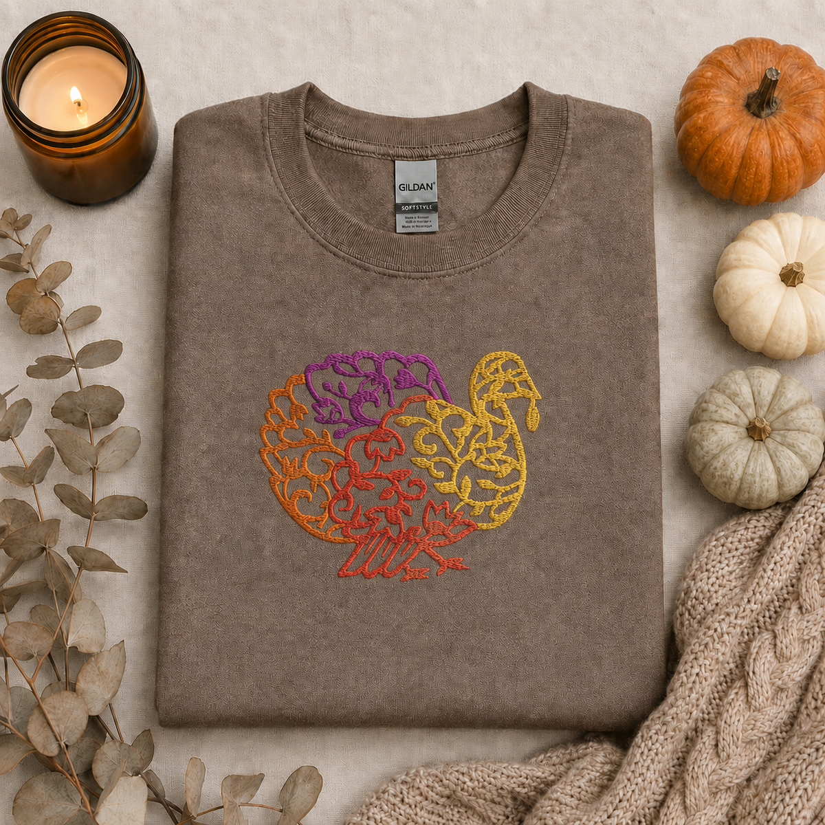 Brown Savanna Gildan Softstyle sweatshirt with centered turkey embroidery flat lay