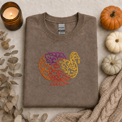 Brown Savanna Gildan Softstyle sweatshirt with centered turkey embroidery flat lay