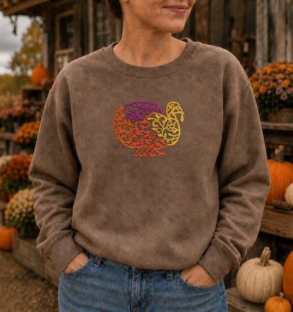 Close view of turkey embroidery on a Brown Savanna Gildan Softstyle sweatshirt