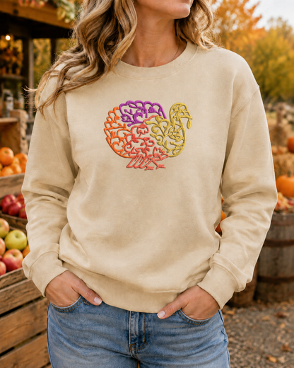 Embroidered turkey Gildan Softstyle sweatshirt in Sand at an autumn apple orchard
