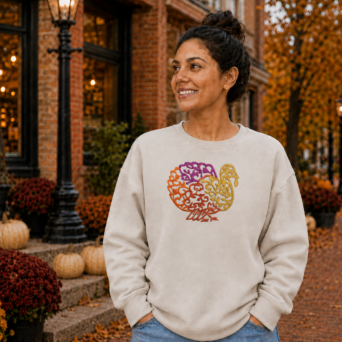 Centered turkey embroidery on a Sand Gildan Softstyle fall crewneck