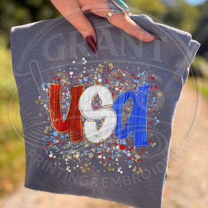 blue jean USA patriotic graphic shirt with trendy Americana splatter artwork