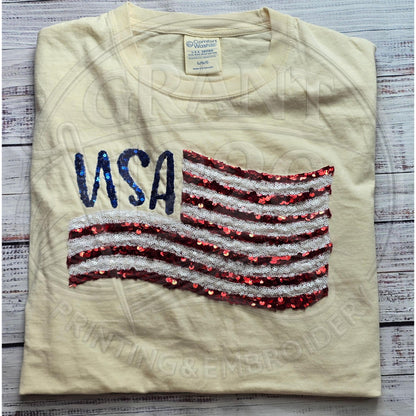 Front view of boutique patriotic shirt featuring handmade sequin American flag design.