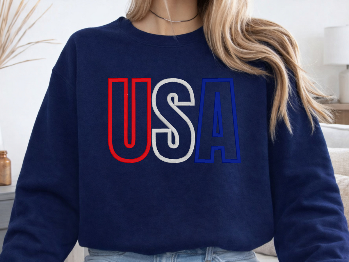 Navy Gildan crewneck sweatshirt with raised USA embroidery in red, white, and blue