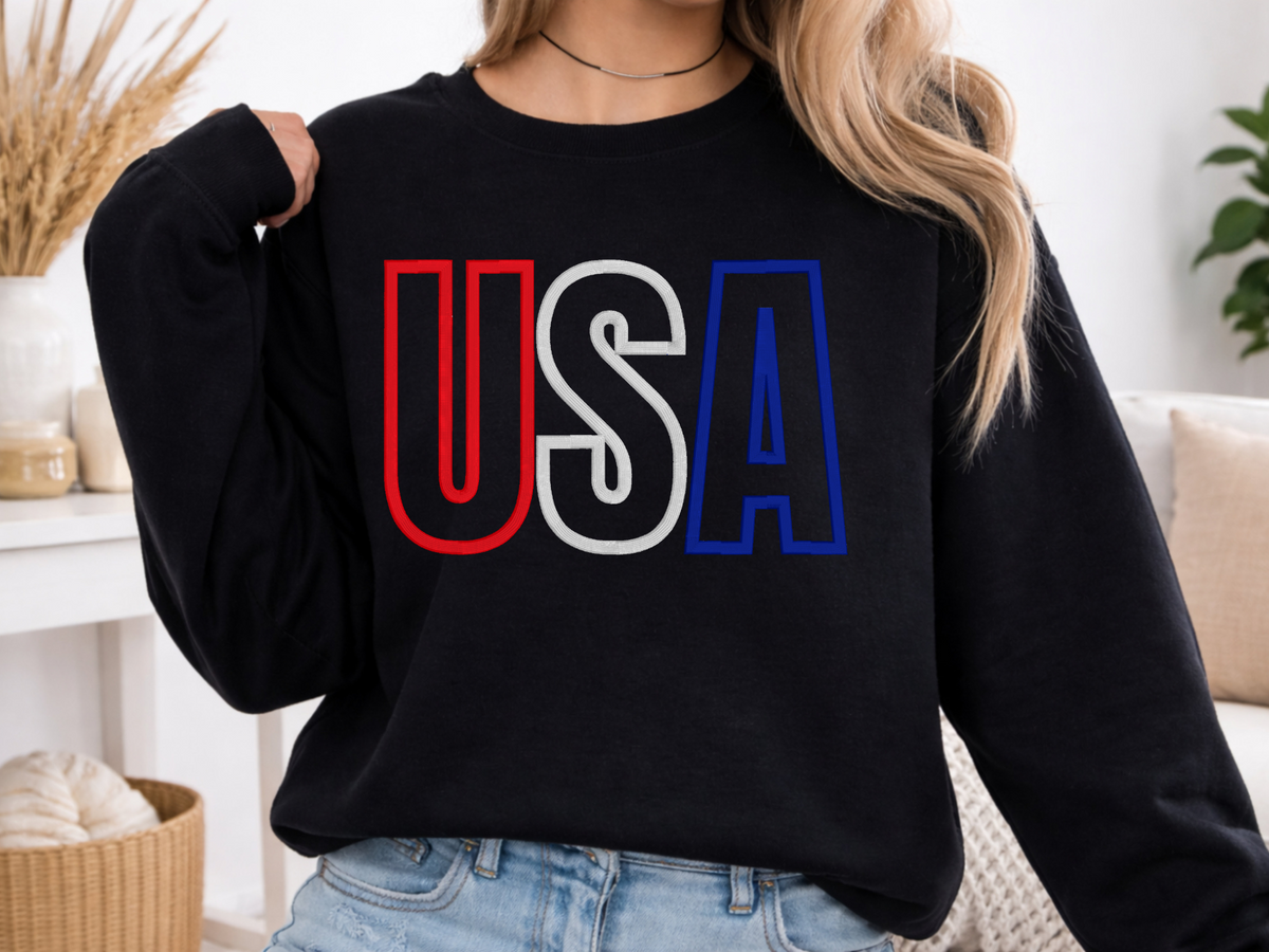Black crewneck sweatshirt showing the USA varsity-style puff embroidery