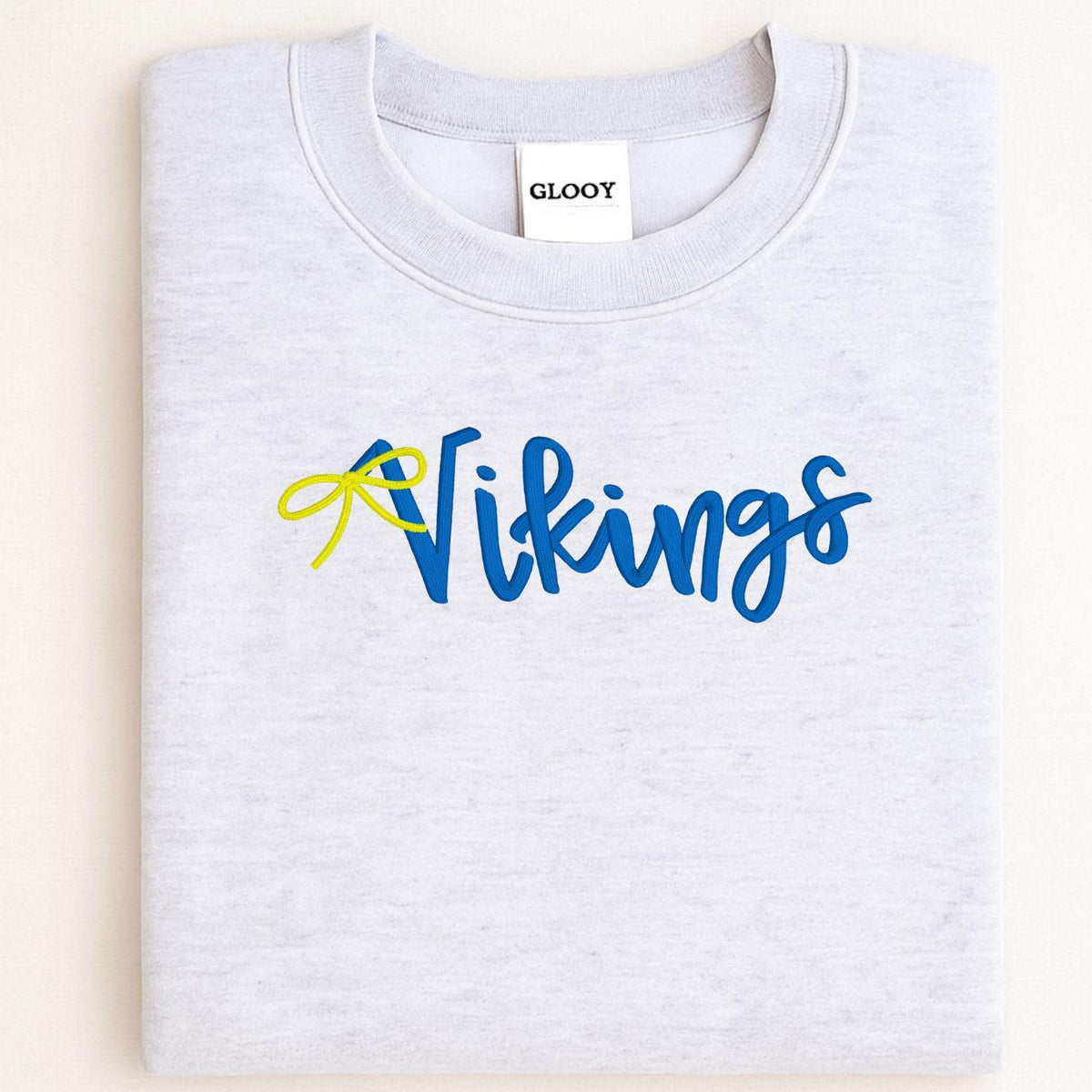Sport gray Vikings script embroidered crewneck folded for a front view