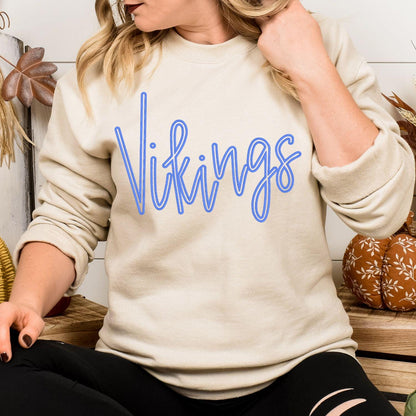 Model wearing sand Vikings script embroidered team sweatshirt