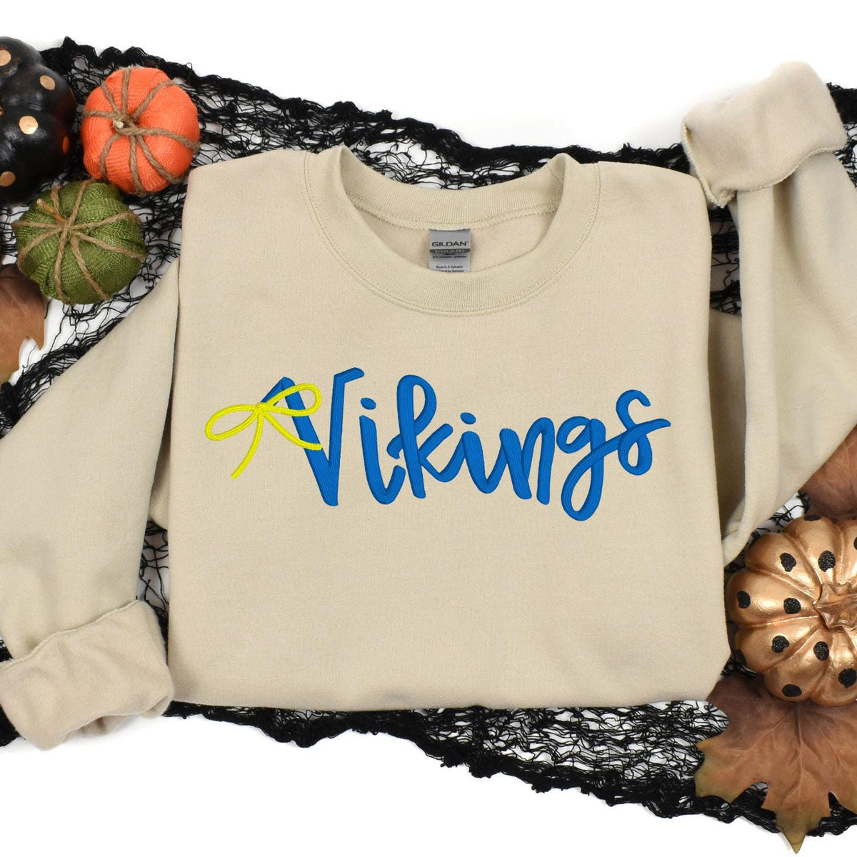Sand Vikings embroidered sweatshirt styled with fall pumpkins and black lace