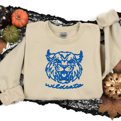 Sand Wildcats mascot sweatshirt styled with fall pumpkins and black lace