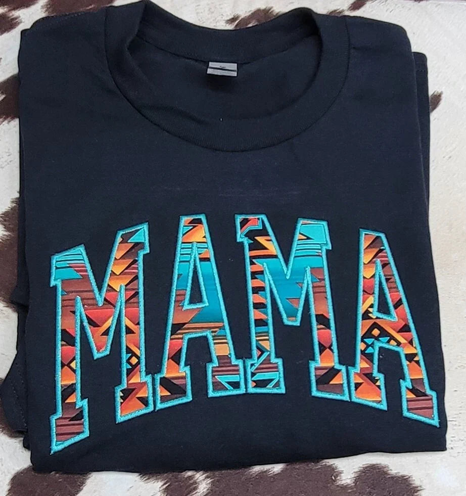 Folded black MAMA Aztec appliqué crewneck sweatshirt showing embroidered western design