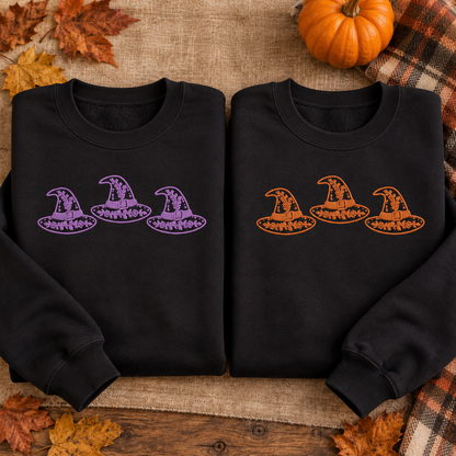 Black embroidered witch hat sweatshirts shown with lavender and orange thread options