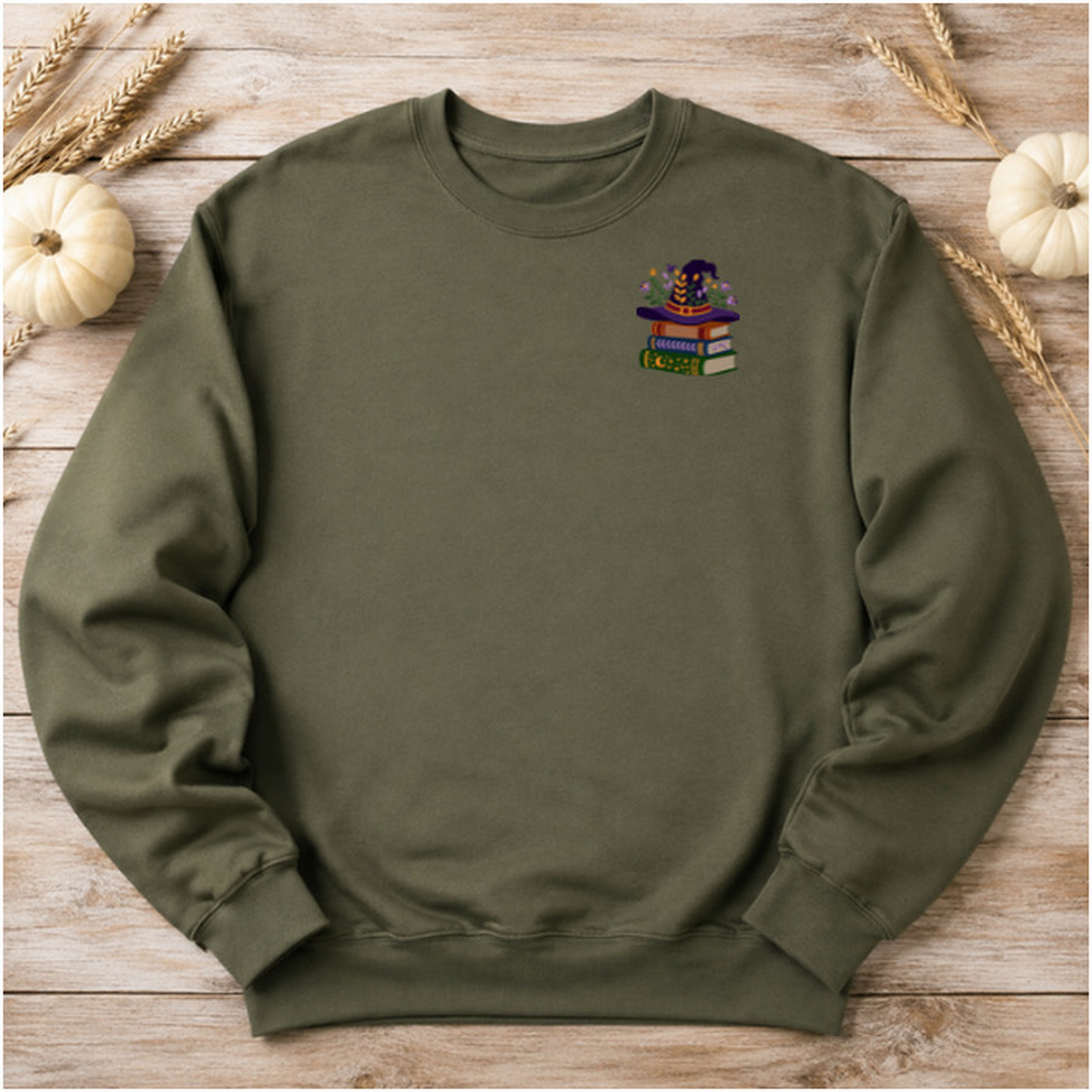 Military Green sweatshirt flat lay with witchy books left chest embroidery