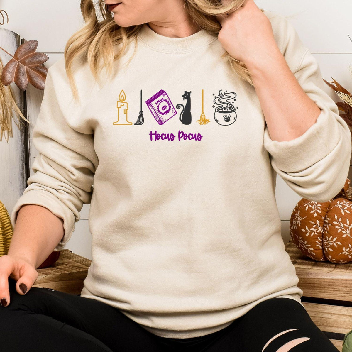 Sand Gildan sweatshirt embroidered with candle spell book black cat broom and cauldron icons