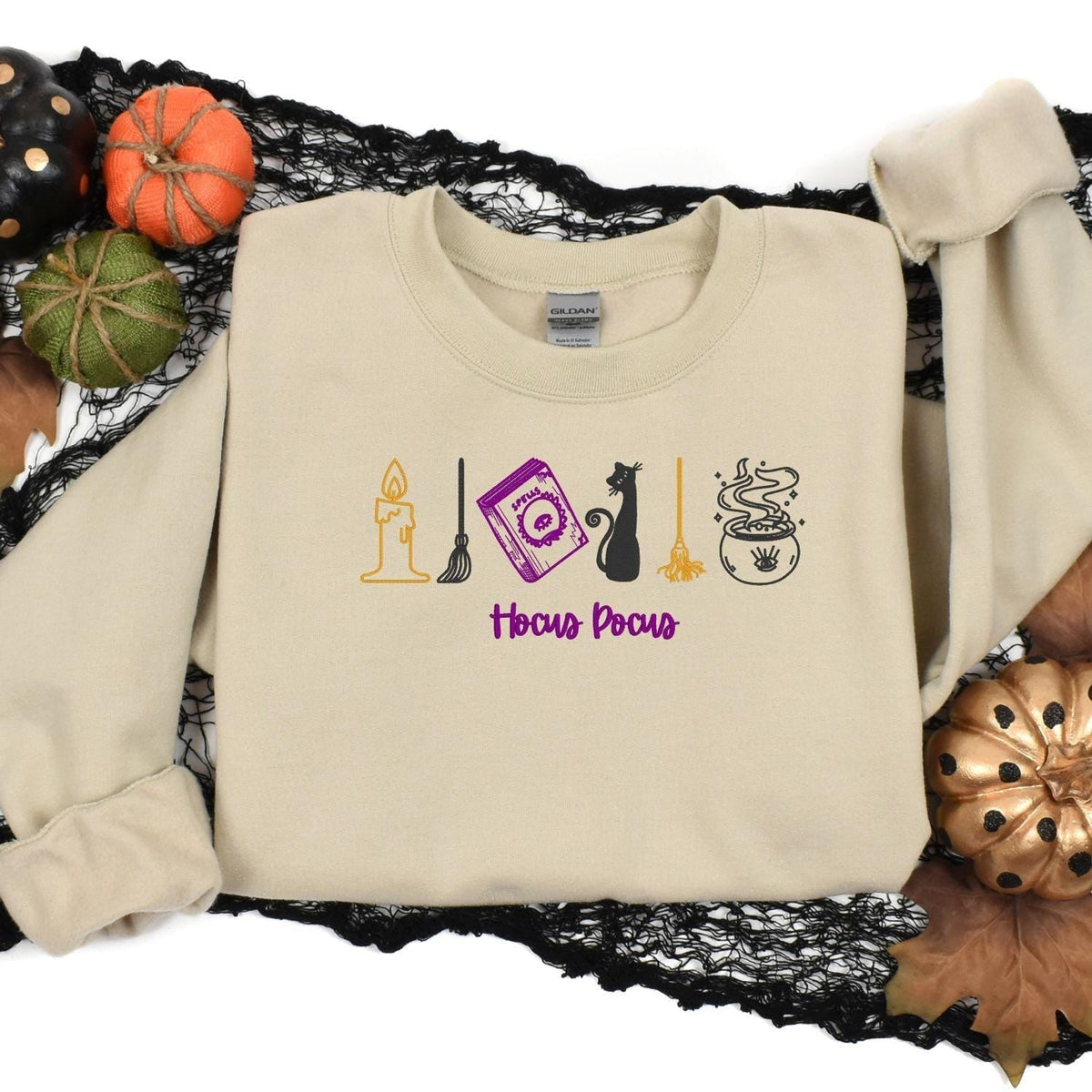 Sand witchy embroidered sweatshirt styled with Halloween pumpkins and black lace