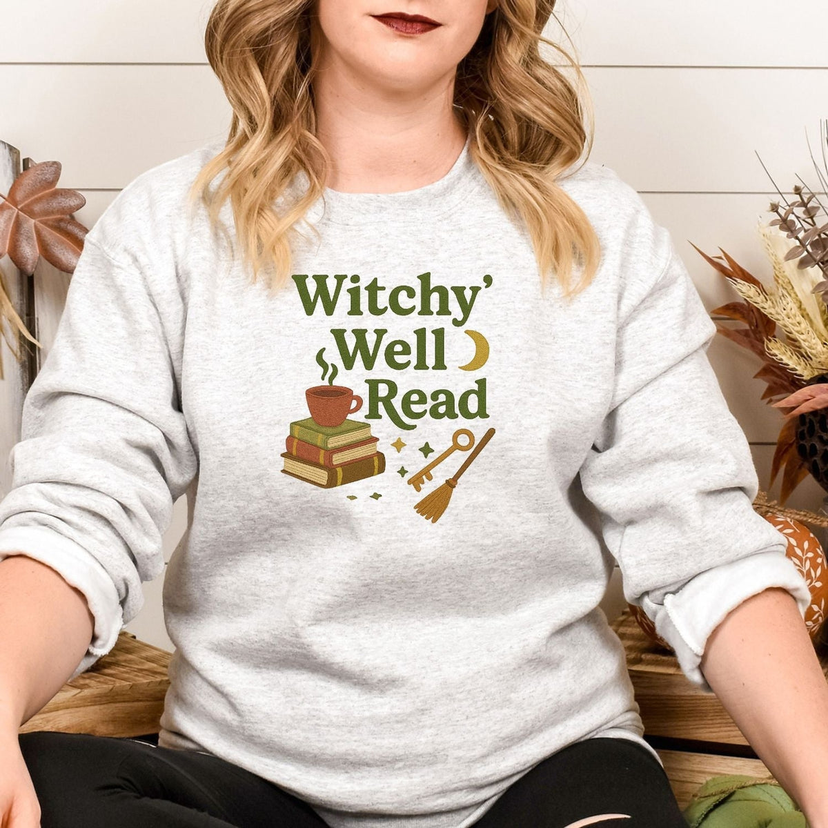 Ash embroidered Witchy Well Read crewneck with stacked books and witchy details