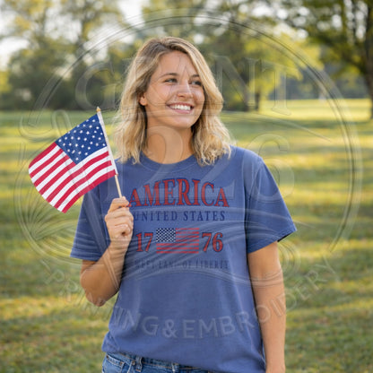 Woman wearing patriotic America 1776 shirt outdoors holding American flag